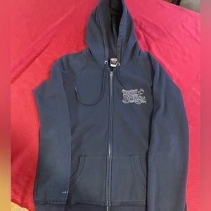 Woman’s black Harley Davidson hooded sweatshirt with zipper front.